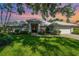Beautiful home showcasing a manicured lawn and meticulously maintained landscaping at 4374 Indian Point Trl, Sarasota, FL 34238