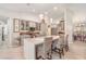 Bright kitchen with pendant lighting, a large island, stainless steel appliances and eat-in counter seating at 4374 Indian Point Trl, Sarasota, FL 34238