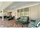 Elegant screened lanai featuring comfortable wicker seating and a coffee table at 4374 Indian Point Trl, Sarasota, FL 34238