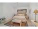 Bright main bedroom with a ceiling fan, neutral tones, and a cozy sitting area at 4374 Indian Point Trl, Sarasota, FL 34238