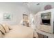 Spacious main bedroom featuring a vaulted ceiling, ensuite bathroom, and ample closet space at 4374 Indian Point Trl, Sarasota, FL 34238