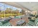 Beautiful screened-in pool and spa with seating area for outdoor relaxation at 4374 Indian Point Trl, Sarasota, FL 34238