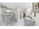 Modern bathroom with a large, glass-enclosed shower and double vanity at 4637 31St E Ct, Bradenton, FL 34203