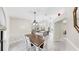 Spacious dining room showcasing an open floorplan with kitchen view and natural light at 4637 31St E Ct, Bradenton, FL 34203