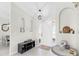 Bright entryway with white tile floors, decorative shelving niches, and views into the dining area at 4637 31St E Ct, Bradenton, FL 34203