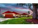 Charming single-story home with a well-manicured lawn, two-car garage, and colorful front-door accent at 4637 31St E Ct, Bradenton, FL 34203