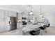 Renovated kitchen with gray cabinets, stainless steel appliances, granite counters, and bar seating at 4637 31St E Ct, Bradenton, FL 34203
