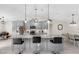 Open kitchen features gray cabinets, granite counters, stainless appliances and seating for entertaining at 4637 31St E Ct, Bradenton, FL 34203