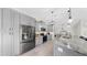 Modern kitchen boasts stainless steel appliances, gray cabinets, and white subway tile backsplash at 4637 31St E Ct, Bradenton, FL 34203