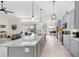 Spacious kitchen island with granite countertops overlooking living and pool area for easy entertaining at 4637 31St E Ct, Bradenton, FL 34203