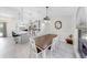 Open-concept kitchen and dining area with island seating and pendant lighting at 4637 31St E Ct, Bradenton, FL 34203