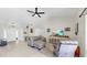 Bright living room showcasing vaulted ceilings, a ceiling fan, and neutral decor at 4637 31St E Ct, Bradenton, FL 34203