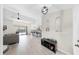 Open-concept living space with tile floors, modern lighting, and views of the backyard pool at 4637 31St E Ct, Bradenton, FL 34203