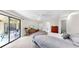 Large main bedroom with access to the lanai, en suite bathroom, and neutral carpeting at 4637 31St E Ct, Bradenton, FL 34203