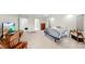 Spacious main bedroom featuring neutral carpet, a ceiling fan, and access to an en suite bathroom at 4637 31St E Ct, Bradenton, FL 34203