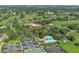 Aerial view of Palm Aire golf community highlighting mature trees, golf course and recreational facilities at 5044 Creekside Trl, Sarasota, FL 34243