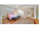 Bright bedroom boasts natural light, an area rug, and access to additional living spaces at 5044 Creekside Trl, Sarasota, FL 34243