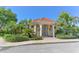 Community building with tile roof and well-maintained landscaping at 5044 Creekside Trl, Sarasota, FL 34243