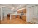 Open-concept kitchen with stainless steel appliances and wooden cabinets at 5044 Creekside Trl, Sarasota, FL 34243