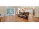 Open-concept living room flows into kitchen with a view of the screened in lanai at 5044 Creekside Trl, Sarasota, FL 34243