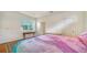 This is a sunny and bright main bedroom featuring a large window with blinds at 5044 Creekside Trl, Sarasota, FL 34243