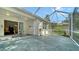 Covered patio with stamped concrete, ceiling fan, and outdoor seating at 5044 Creekside Trl, Sarasota, FL 34243