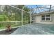 Screened patio with a beautiful garden view at 5044 Creekside Trl, Sarasota, FL 34243