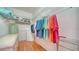 Walk-in closet features custom organizers and ample storage space for clothing at 5044 Creekside Trl, Sarasota, FL 34243