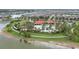 Aerial view of community pool, clubhouse, and playground, surrounded by lush landscaping and residential homes at 5213 Patano Loop, Palmetto, FL 34221