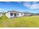 A spacious backyard with a covered patio offers an amazing outdoor living space at 5213 Patano Loop, Palmetto, FL 34221