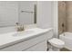 Bathroom featuring a sink, mirror, toilet, and tile shower at 5213 Patano Loop, Palmetto, FL 34221