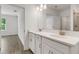 Modern bathroom with dual sinks, quartz countertops, and decorative vanity cabinets at 5213 Patano Loop, Palmetto, FL 34221
