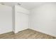 An empty bedroom featuring a hardwood floor, white walls, and a closet at 5213 Patano Loop, Palmetto, FL 34221