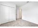 Bedroom features closet, neutral carpet and a door to another room at 5213 Patano Loop, Palmetto, FL 34221