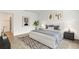 Modern bedroom with stylish decor, wood-look tile flooring, and comfortable furnishings at 5213 Patano Loop, Palmetto, FL 34221