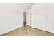 Bedroom featuring a hardwood floor, white walls, and an entrance at 5213 Patano Loop, Palmetto, FL 34221