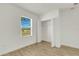 Bedroom featuring a hardwood floor, white walls, and an open closet at 5213 Patano Loop, Palmetto, FL 34221