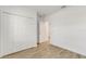 Bedroom featuring a hardwood floor, white walls, and a large closet at 5213 Patano Loop, Palmetto, FL 34221