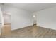 Bedroom featuring a hardwood floor, white walls, an entrance, and a view of the bathroom at 5213 Patano Loop, Palmetto, FL 34221