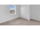 Bedroom features window and closet with neutral carpet flooring at 5213 Patano Loop, Palmetto, FL 34221