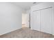 Bedroom features closet, neutral carpet and a door to another room at 5213 Patano Loop, Palmetto, FL 34221