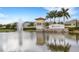 Community entrance with fountain and palm trees overlooking the 'Trevesta' sign on a sunny day at 5213 Patano Loop, Palmetto, FL 34221