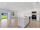 Open-concept kitchen featuring white cabinets, stainless steel appliances, and a center island perfect for entertaining at 5213 Patano Loop, Palmetto, FL 34221