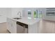Beautiful kitchen island featuring a sink and dishwasher, perfect for meal preparation and cleaning at 5213 Patano Loop, Palmetto, FL 34221