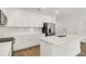 Contemporary kitchen with white cabinets, quartz countertops, stainless steel appliances, and tile floors at 5213 Patano Loop, Palmetto, FL 34221