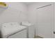 Laundry room features modern washer and dryer and storage space at 5213 Patano Loop, Palmetto, FL 34221