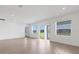 Bright living room with recessed lighting and sliding glass doors that lead to the back yard at 5213 Patano Loop, Palmetto, FL 34221