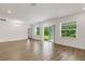Open floor plan with windows and sliding door with view of the backyard and natural light at 5213 Patano Loop, Palmetto, FL 34221