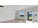 Bright living room with recessed lighting and sliding glass doors that lead to the back yard at 5213 Patano Loop, Palmetto, FL 34221