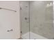 Modern bathroom shower with marble-look tile and glass enclosure at 5213 Patano Loop, Palmetto, FL 34221